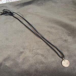 Round Textured Metallic Pendant on Black Cord